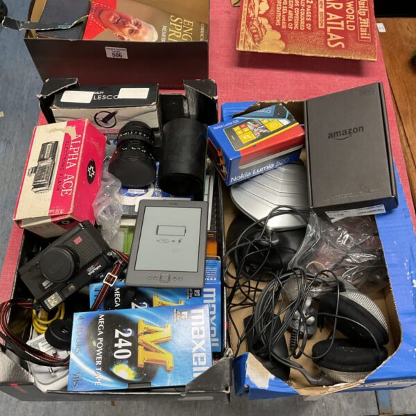 Mixed electrical lot with cameras, Kindle, and Alexa button.