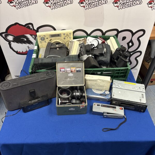 Mixed electrical lot with Sony Walkman and camera accessories.