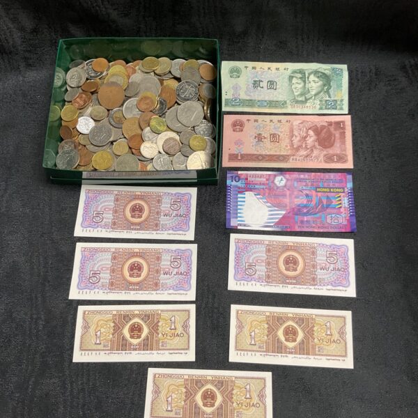 Mixed lot of foreign coins and Chinese banknotes for collectors.