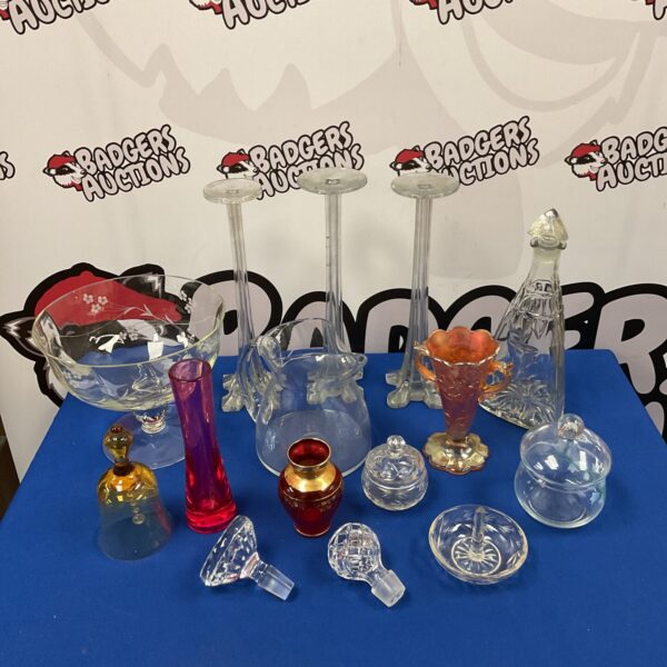Colourful mixed glassware collection including carnival glass and rayware.