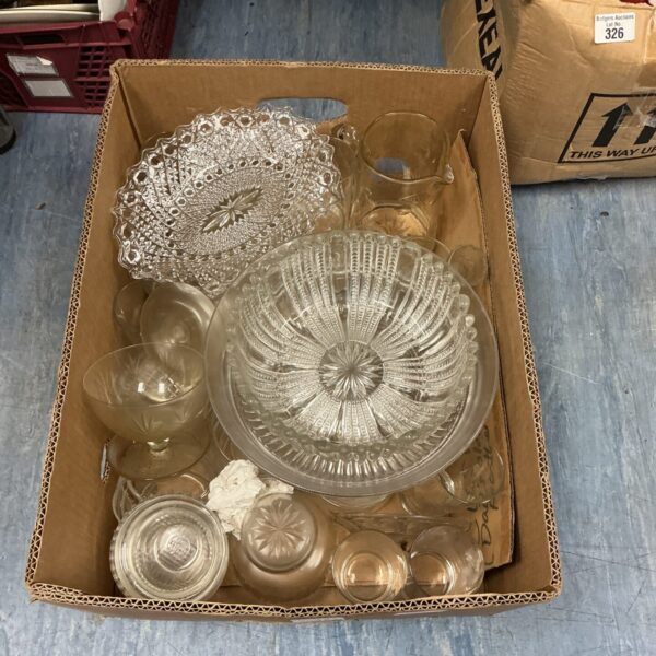 Mixed glassware lot featuring a two-tier cake stand and assorted dishes.