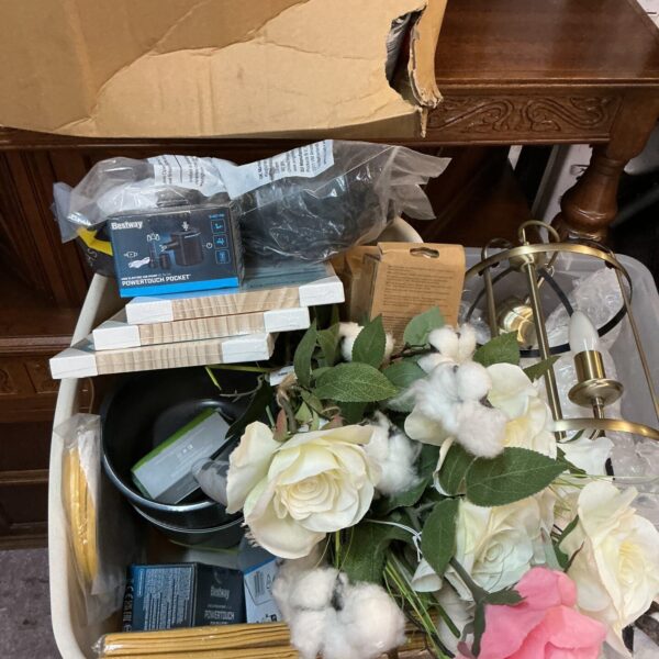 Mixed lot of artificial flowers and ceramic pots for home decor.