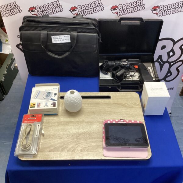 Mixed lot of technology including Kindle, Dell bag, and digital camera.