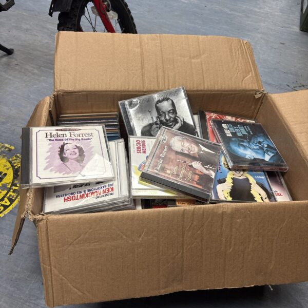 Box of mixed music CDs for collectors and enthusiasts.