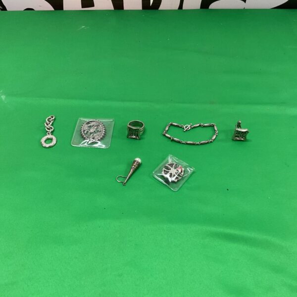 Mixed silver jewellery lot with necklaces and bracelets.