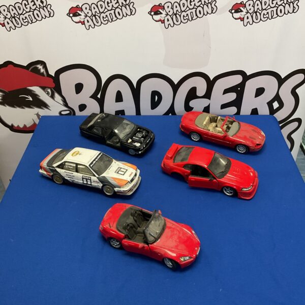 Diverse model car collection including Honda, Audi, and BMW.