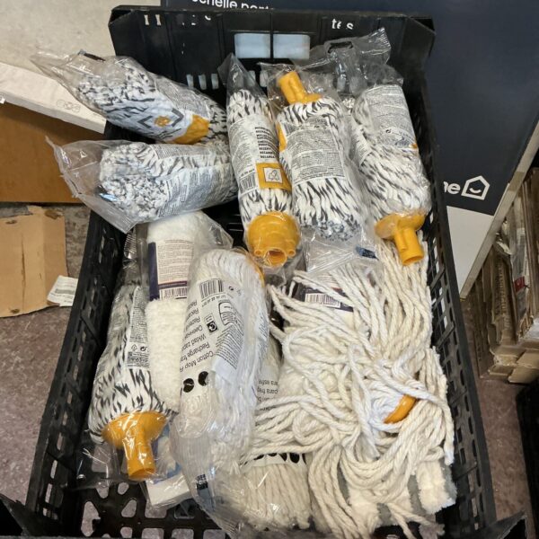 Bulk lot of new cotton mop heads for floor cleaning.