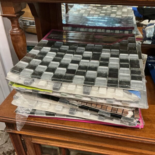 Sealed mosaic tile packs for home renovation projects.