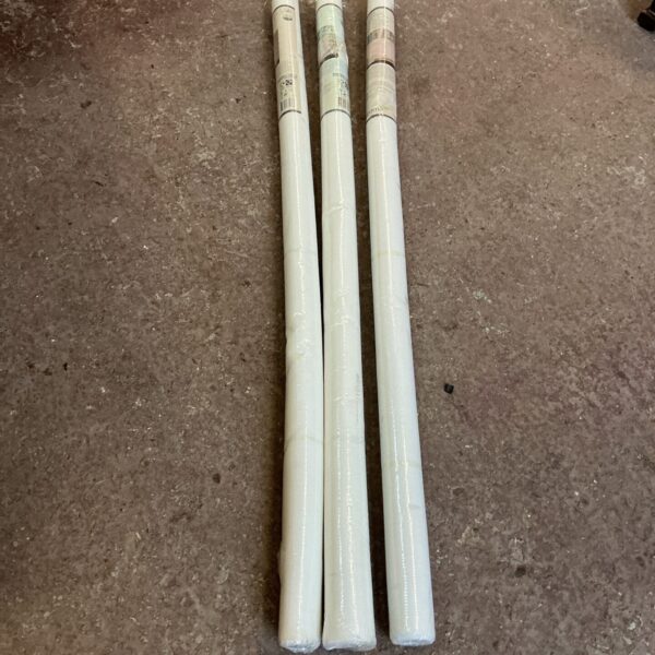 Three rolls of mosquito netting, wrapped and ready for use.