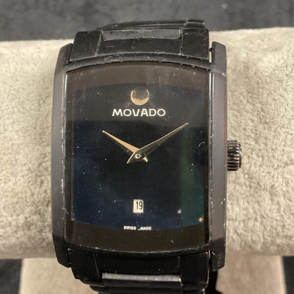 Front view of a stainless steel Movado quartz wristwatch.