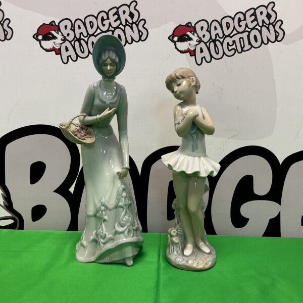Elegant Nao porcelain ballerina figurine on a green background.
