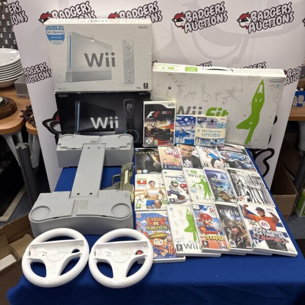Nintendo Wii bundle with games and accessories.