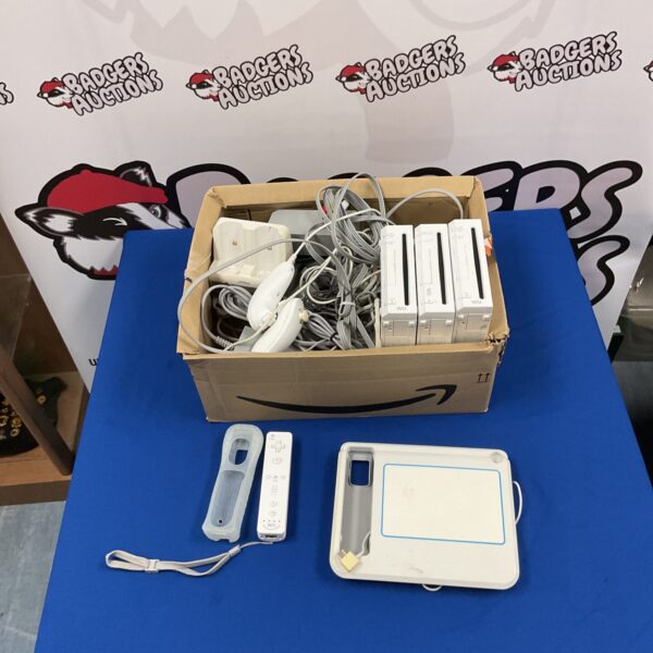 Nintendo Wii console bundle with accessories for retro gaming.