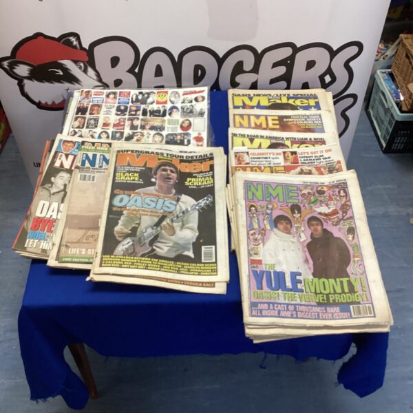 Vintage bundle of NME music newspapers with sticker sheets.