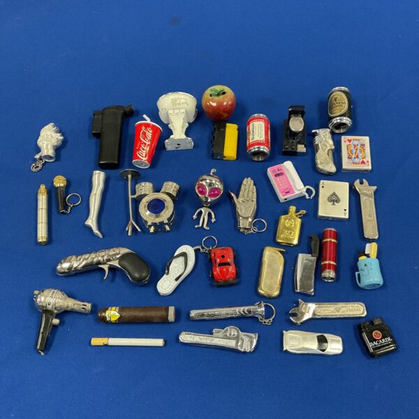 Vintage novelty gas lighters collection, unique collectible designs.