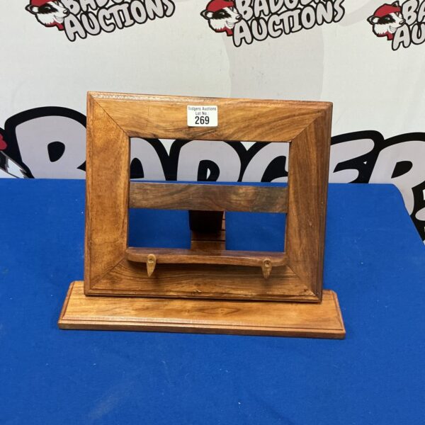 Vintage oak recipe book stand for displaying cookbooks in the kitchen.