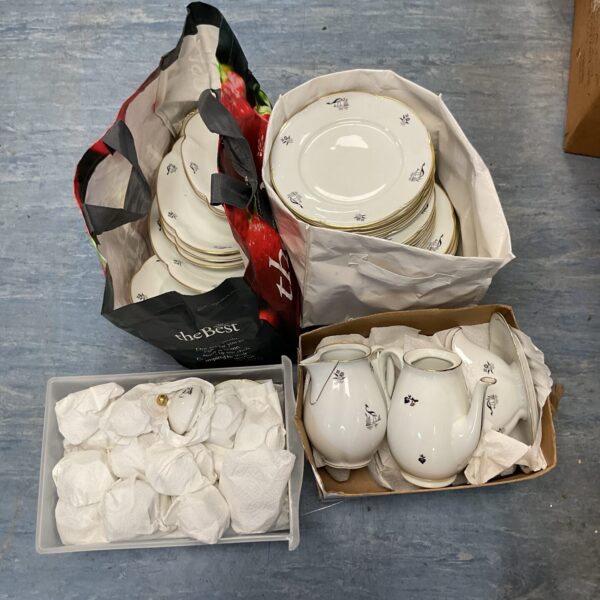 Vintage Ohme German China dinner set with gold trim.