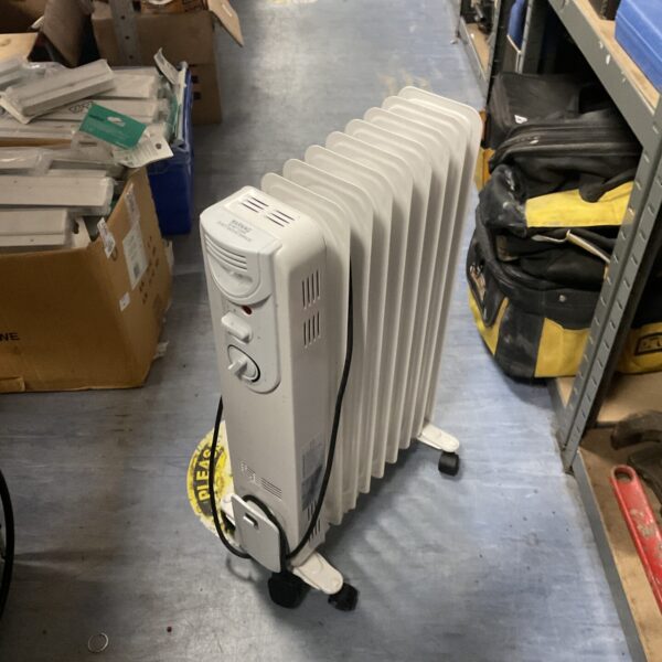 White oil filled radiator with thermostat for portable home heating.