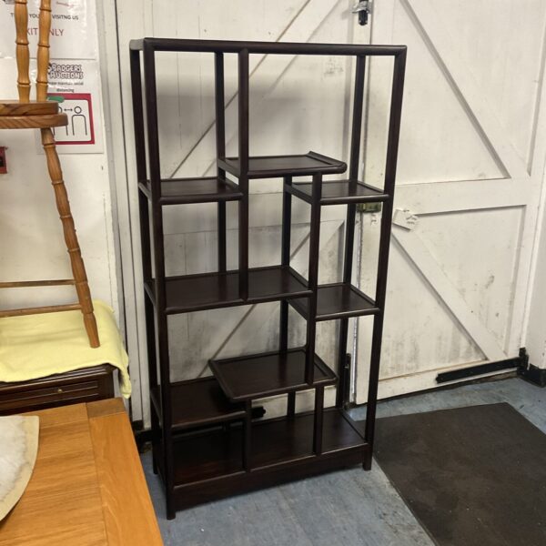 Vintage oriental mahogany display shelf with staggered levels.