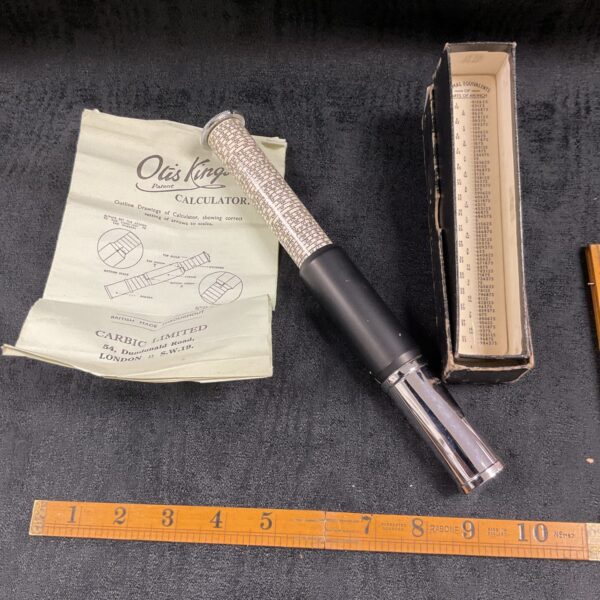 Antique Otis King calculator with sliding scales and indicators.