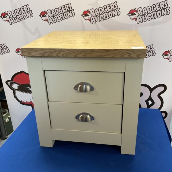 Small painted pine bedside cabinet with three drawers.