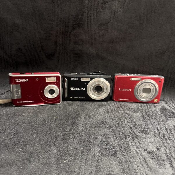 Digital camera lot featuring Panasonic Lumix, Casio Exilim, and Technic models.