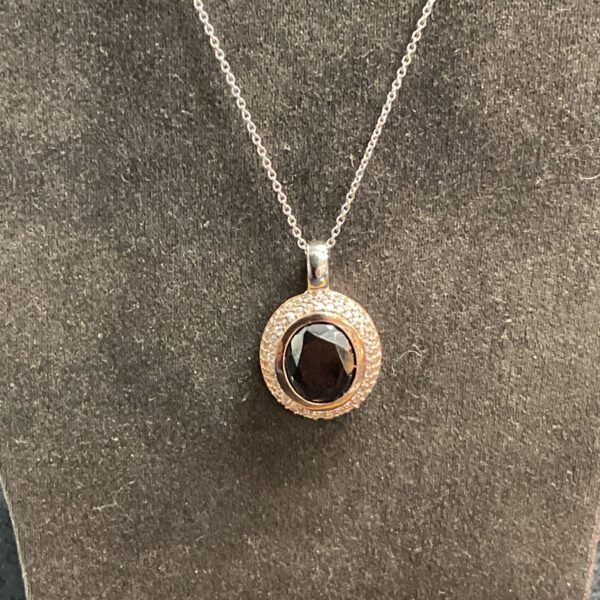Pandora silver necklace with black stone pendant.