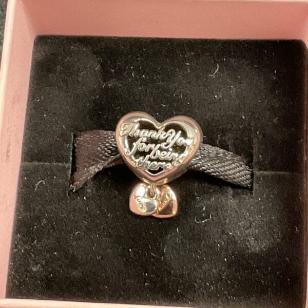 Pandora thank you charm with silver and gold heart detail.