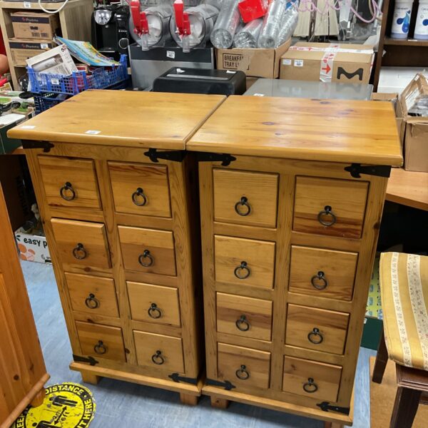 Pair of chunky pine drawer units offering ample storage.