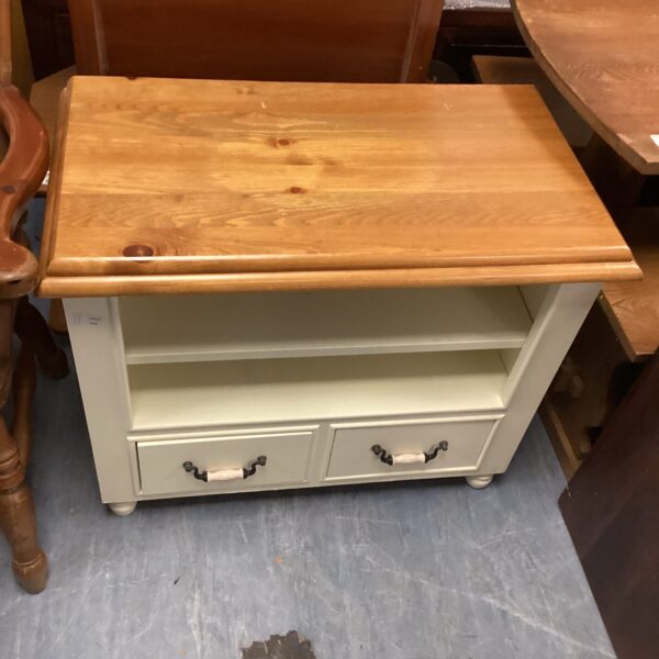 Rustic pine media cabinet with single drawer and open shelf.