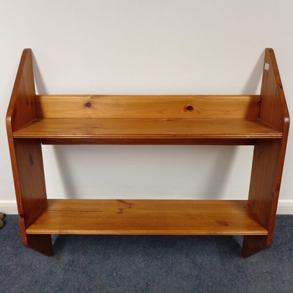 Rustic pine wall shelves unit for home storage and display.
