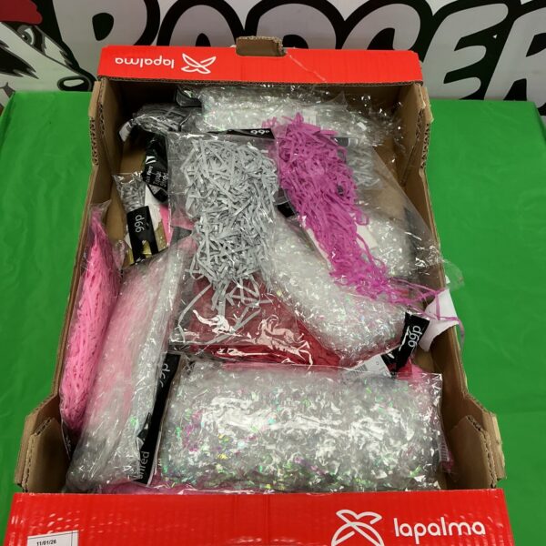Pink shredded table decorations for party events.
