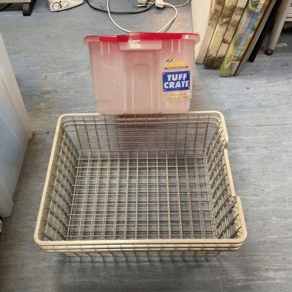 Plastic storage crate with three wire trays inside.