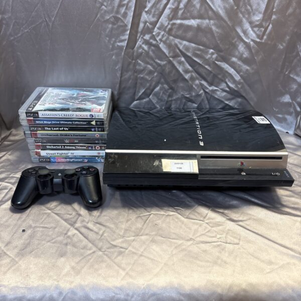 Sony PlayStation 3 console with games and controller displayed.
