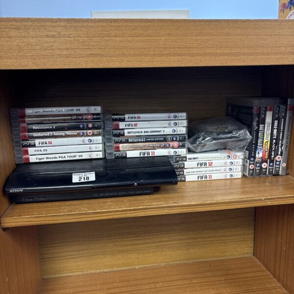 PlayStation 3 Super Slim console with games and accessories bundle.