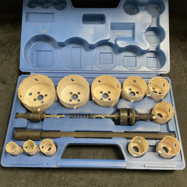 Power Master hole saw set in open case with drill bits.