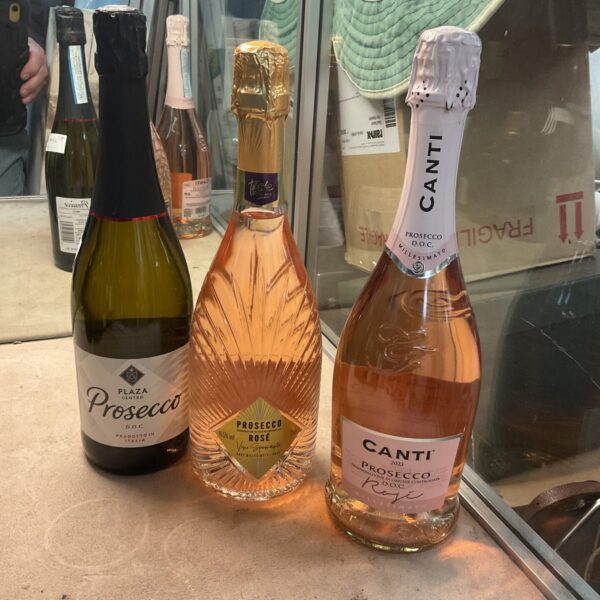 Three bottles of Prosecco, Italian sparkling wine collection.