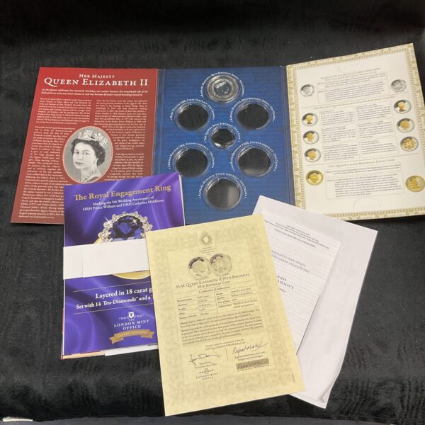 Queen Elizabeth II 90th birthday coin set in folder.
