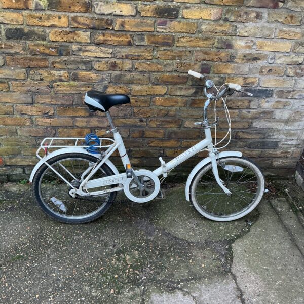 Vintage Raleigh compact folding bike in white condition.