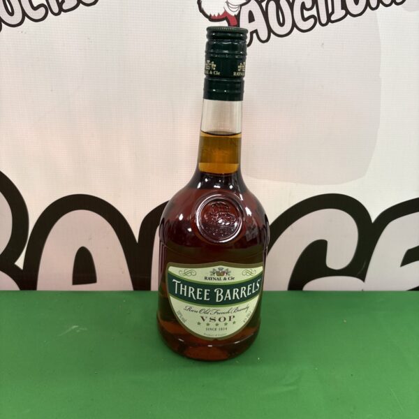 Vintage Raynal Three Barrels French brandy bottle with seven ECL label.