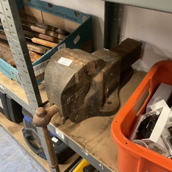 Close-up of a vintage Record No23 bench vice, a sturdy workshop tool.