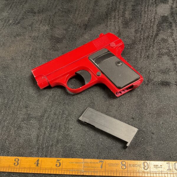 Red airsoft BB pistol replica for collectors and enthusiasts.