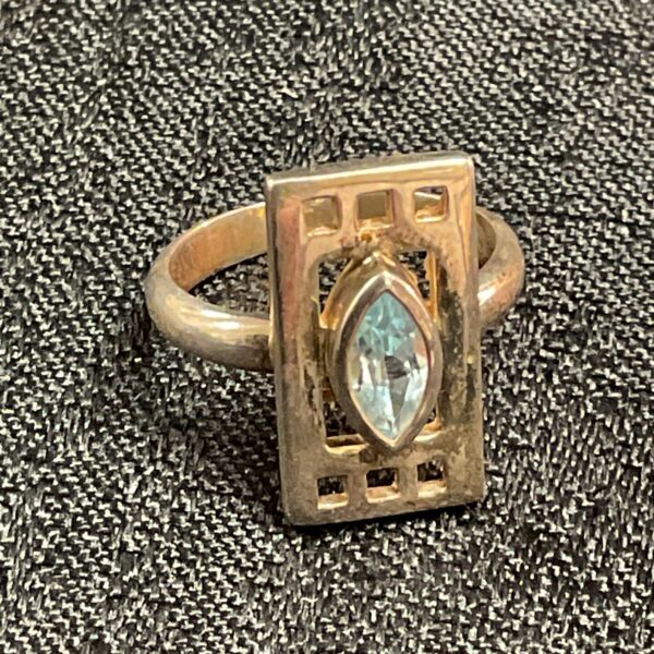 Silver Rennie Mackintosh style ring with marquise topaz gemstone.