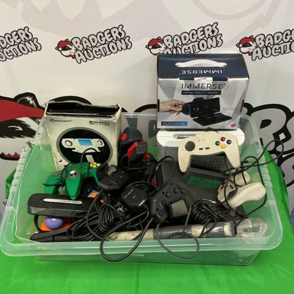 Retro gaming accessories lot with Nintendo 64 controller and joysticks.