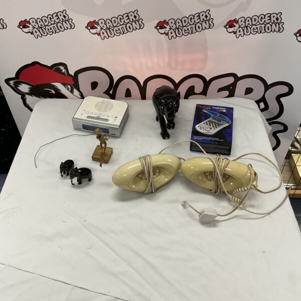 Retro telephone lot featuring a red Genie phone, alarm clock, and chess set.