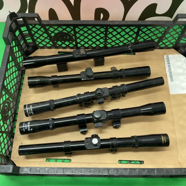 Lot of five vintage rifle scopes, including Tasco and Webley brands.