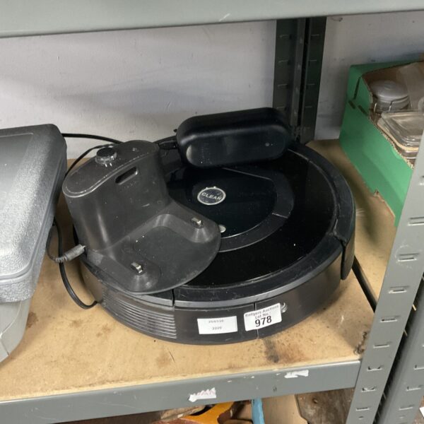 Untested robotic vacuum cleaner with charging dock for home cleaning.