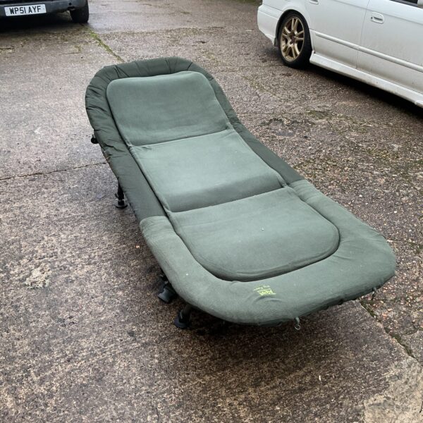 Used Rod Hutchinson fishing bed for comfortable angling sessions.