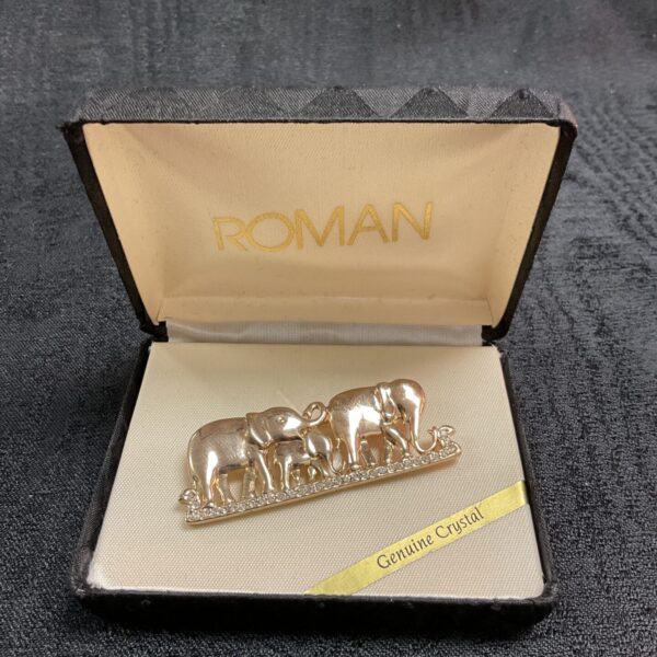 Vintage Roman crystal elephant brooch with sparkling details.