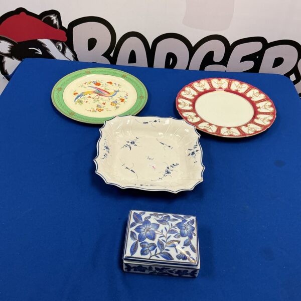 Vintage Royal Doulton porcelain plate collection for display.